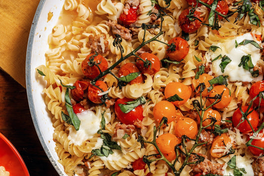 A large bowl of One-Pot Cherry Tomato & Sausage Rotini.