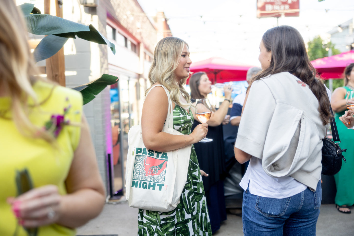 pasta night tote bag displayed by woman