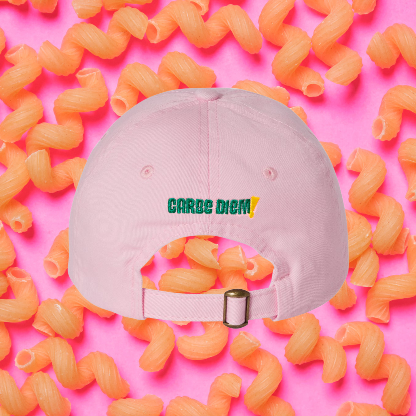 Pink cap with 'Carbe Diem' logo on a white background