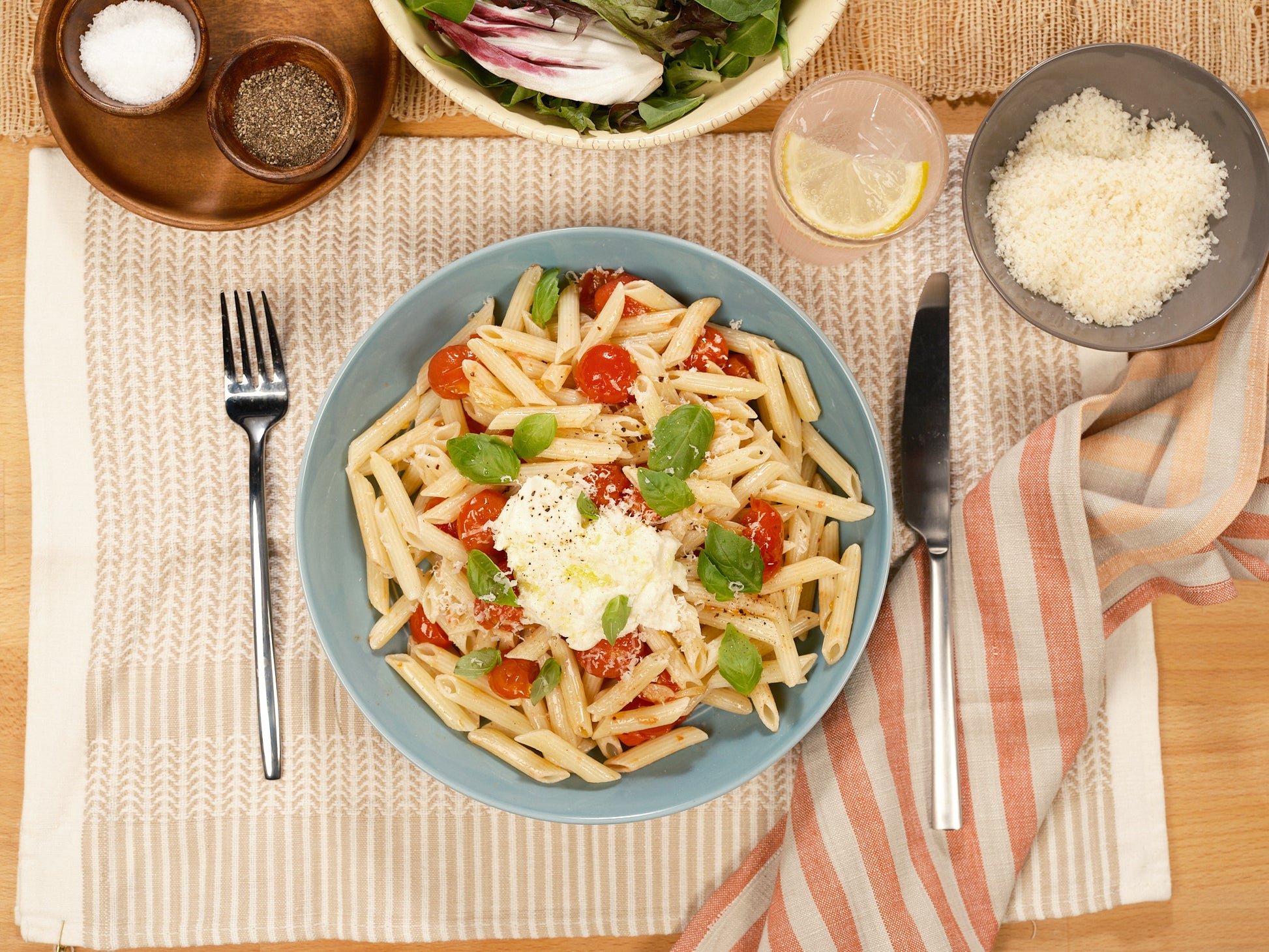 Image #4 plated penne pasta on table, overhead view