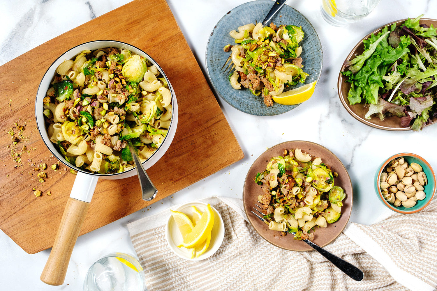 Elbows with italian sausage, brussels sprouts, pistachios and lemon