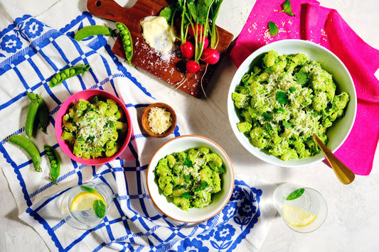 Three bowls of elbow pasta with Pea-Ricotta Pesto