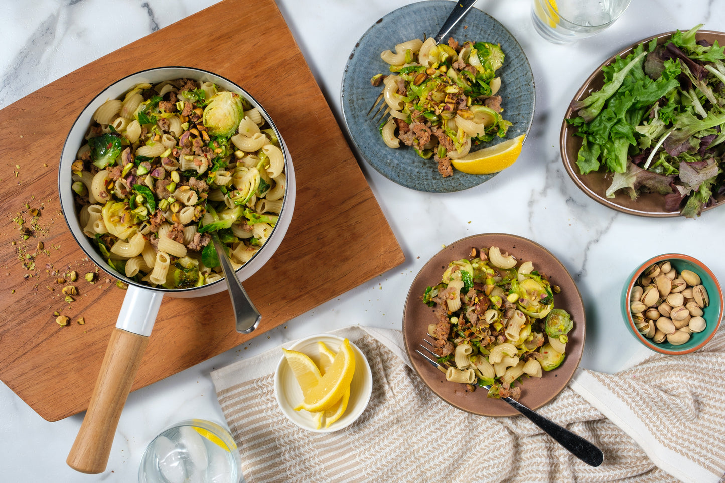 Elbows with italian sausage, brussels sprouts, pistachios and lemon
