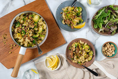 Elbows with italian sausage, brussels sprouts, pistachios and lemon