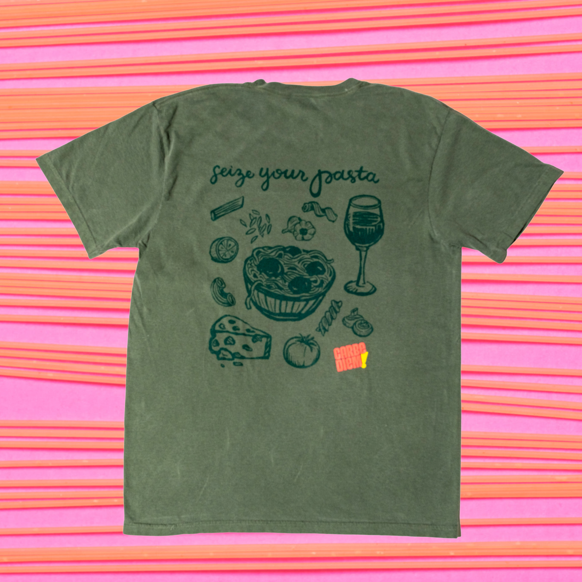 Green t-shirt with pasta-themed graphics and text reading "Seize your pasta" on a white background.