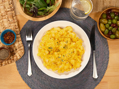 mac and cheese elbows pasta plated on table, overhead view