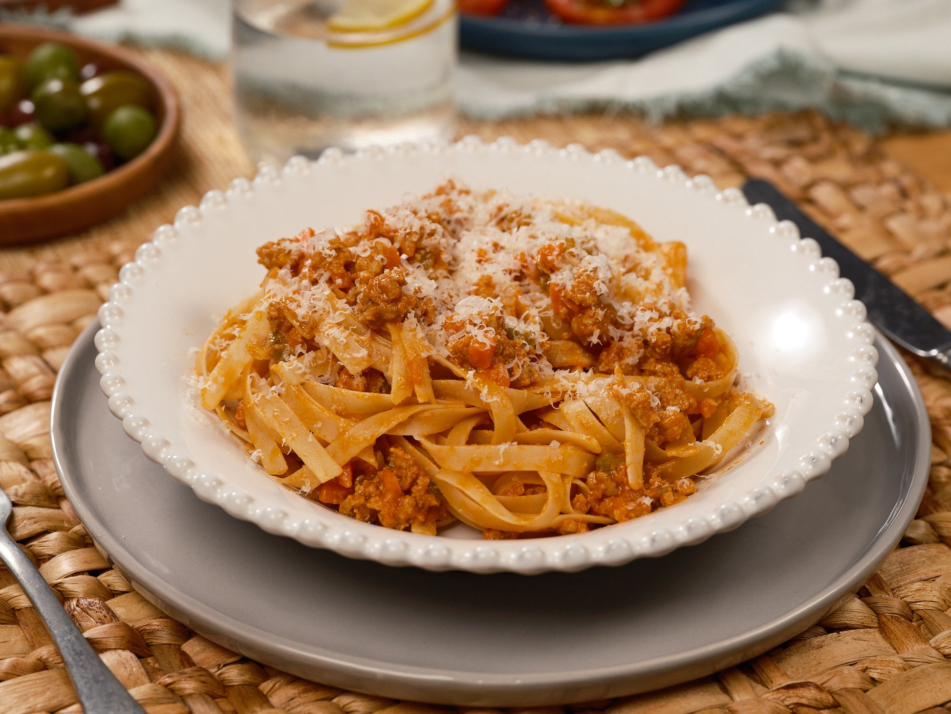 Image #3 plated fettuccine on table, side view