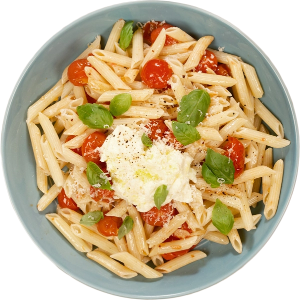 Pasta dish with tomatoes and basil in a blue bowl