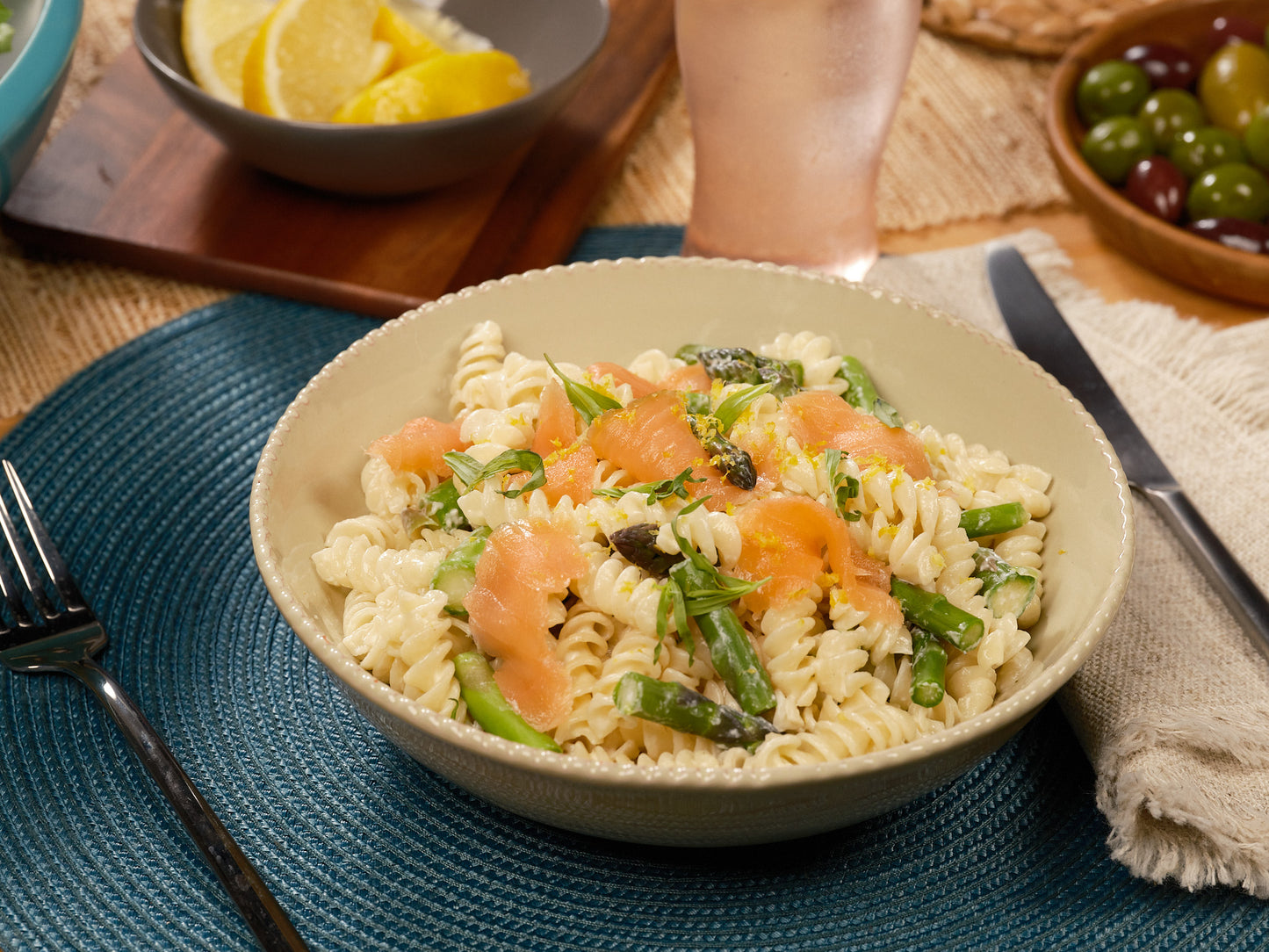 Reduced calorie rotini pasta plated on table, side view